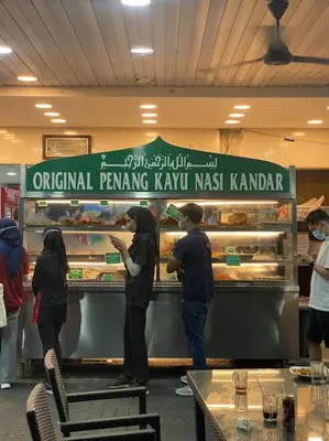 a group of people preparing food in a bakery at 4 PAX ONE BEDROOM SOHO near USM SPICE ARENA AIRPORT MUTIARA SPECIALIST in Bayan Lepas