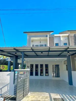 a large white house with a metal roof at Entire Vacation Home with landscape garden in Sitiawan