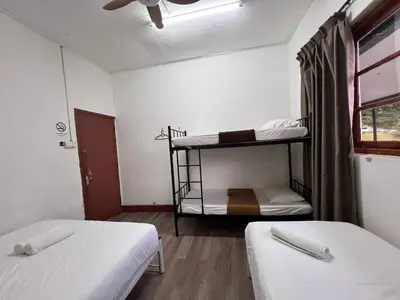 a room with two bunk beds and a window at Mountain View Guesthouse Cameron Highlands in Tanah Rata