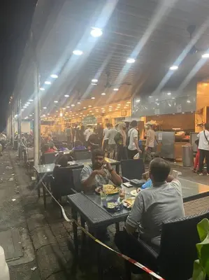 a group of people sitting at tables in a restaurant at 4PAX near USM n Pantai Hospital n PISA SPI CE ARENA in Bayan Lepas