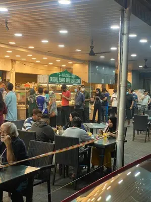 a group of people sitting at tables in a restaurant at 4PAX near USM n Pantai Hospital n PISA SPI CE ARENA in Bayan Lepas