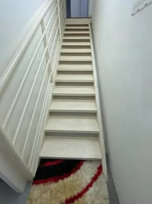 a stairway with a rug and a stair case at 4PAX near USM n Pantai Hospital n PISA SPI CE ARENA in Bayan Lepas