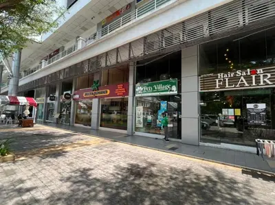a store front of a building with many windows at 6PAX NEAR USM n PANTAI HOSPITAL n SPI CE ARENA in Bayan Lepas