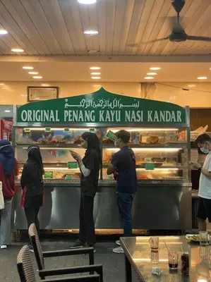 a group of people preparing food in a bakery at 6PAX NEAR USM n PANTAI HOSPITAL n SPI CE ARENA in Bayan Lepas
