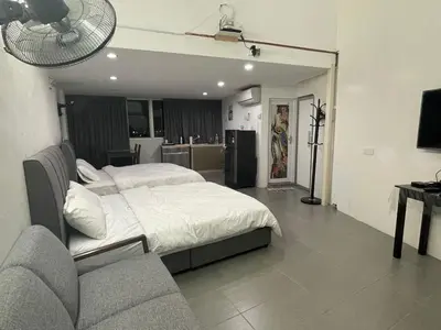 a bedroom with a bed and a couch in it at 6PAX NEAR USM n PANTAI HOSPITAL n SPI CE ARENA in Bayan Lepas