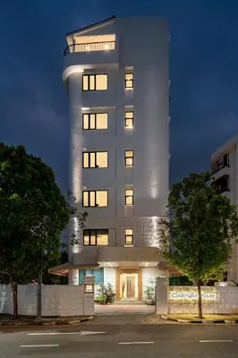 a tall building with lights on in front of it at Codrington House - Boutique Apartments in George Town