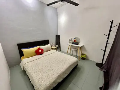 a bedroom with a bed with a stuffed animal on it at Cozy24#4pax#wifi&netflix#NearAeonAlma#Heritage in Bukit Mertajam