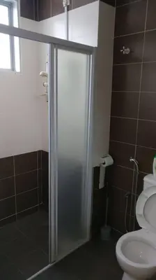 a bathroom with a shower and a toilet at Setia Residen Semi-D two half storey 5 Bedrooms unlimited wifi in Sitiawan