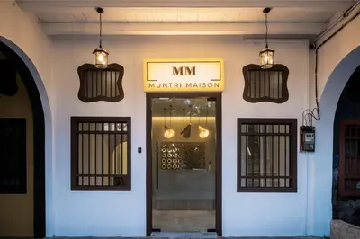 a building with two pendant lights and a doorway at Muntri Maison in George Town