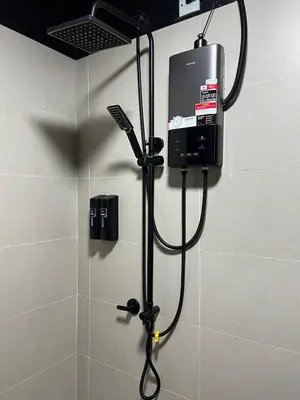 a shower in a bathroom with a shower at HASSMA Studio Apartment at Kompleks Mutiara GM in Gua Musang