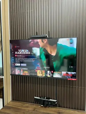 a large flat screen tv with a movie on it at HASSMA Studio Apartment at Kompleks Mutiara GM in Gua Musang