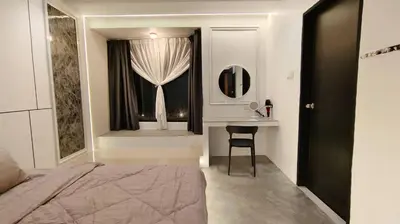 a bedroom with a bed and a desk and a window at I Do Farmstay in Bukit Mertajam