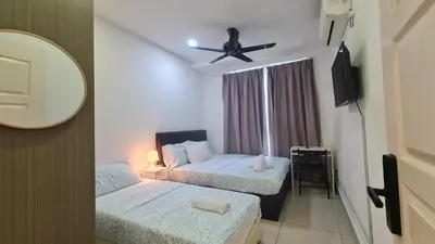 a room with two beds and a ceiling fan at Rooms at Mansion One, Shared Apartment Only in George Town