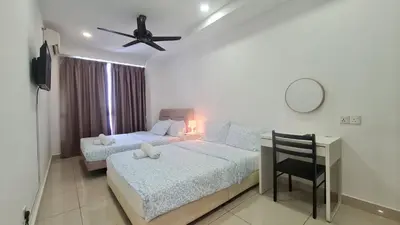a bedroom with two beds and a desk with a ceiling fan at Rooms at Mansion One, Shared Apartment Only in George Town