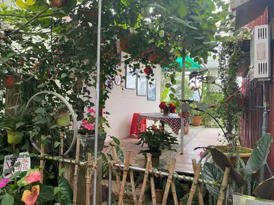 a garden with a bunch of plants and flowers at New Farmer Hut 2 in Brinchang