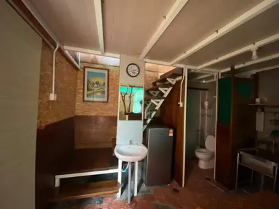 a bathroom with a sink and a toilet at New Farmer Hut 2 in Brinchang