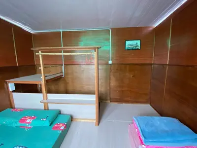 a small room with a bunk bed in a boat at New Farmer Hut 2 in Brinchang