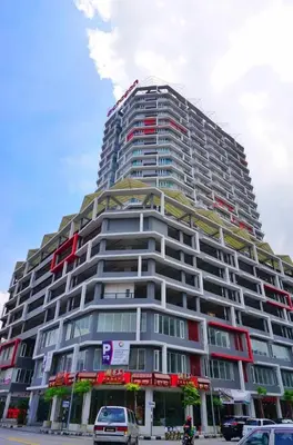 a large building with cars parked in front of it at Ipoh Town - Octagon Cozy Deluxe Homestay in Ipoh