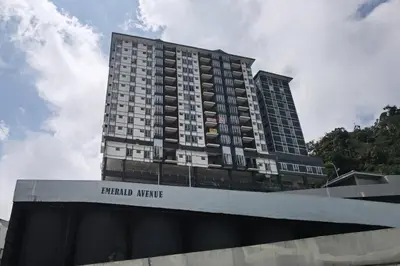a tall building with the words emerald mortgage on it at Emerald Avenue Cozy 1BR Studio Suite in Brinchang