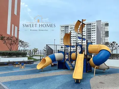 a playground with a slide in a park at Blue Studio Suite 1-4pax B'Worth Prai@SwimmingPool in Perai