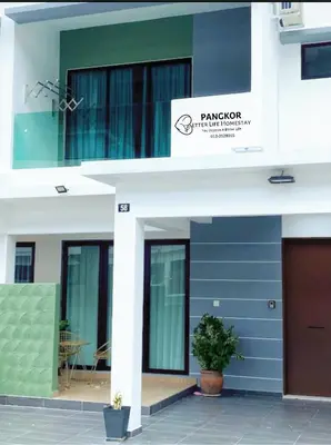 a blue and white building with a sign on it at Pangkor Villa88 Double Storey 3min to Pasir Bogak Beach in Pangkor