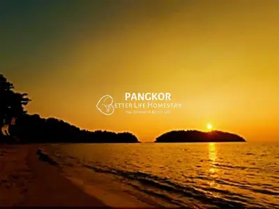 a picture of the sun setting over the ocean at Pangkor Villa88 Double Storey 3min to Pasir Bogak Beach in Pangkor