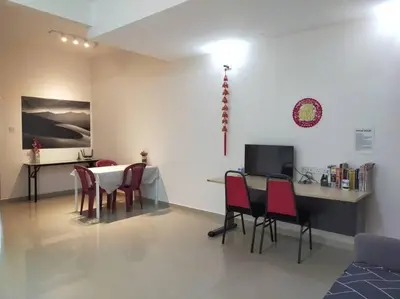 a dining room with a table and chairs at Cheerful 3-Bedroom Residential Home with Free WIFI in Butterworth