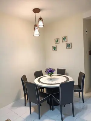 a dining room with a table and chairs at Alyaleesya Emerald avenue 4 Brinchang for muslim in Brinchang