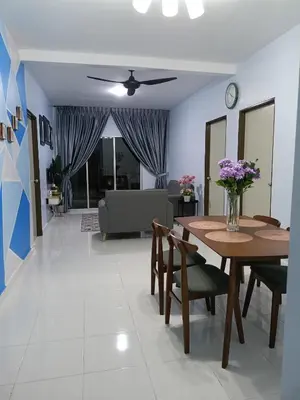 a living room with a table and chairs and a couch at Alyaleesya homestay Emerald Avenue 1 Brinchang in Brinchang