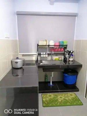 a small kitchen with a sink and a counter at Alyaleesya homestay Emerald Avenue 1 Brinchang in Brinchang