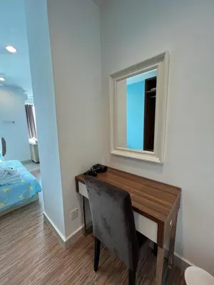 a room with a desk with a mirror and a chair at Mansion One l 4pax Studio l Cityview l Gleneagle l by PerfectSweetHome in George Town