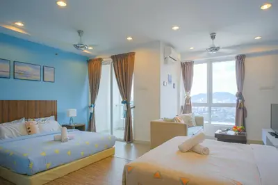 a bedroom with two beds and a living room at Mansion One l 4pax Studio l Cityview l Gleneagle l by PerfectSweetHome in George Town