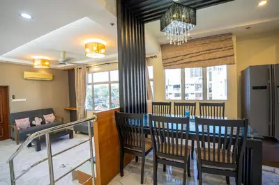 a dining room with a table and chairs at Cozy Gurney Georgetown Private Apartment Penang in George Town