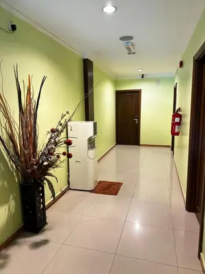an empty hallway with a refrigerator in a building at GOA INN HOTEL SDN BHD in Gua Musang