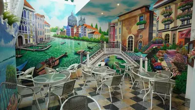 a restaurant with a mural of a canal at Kimberley Boutique Hotel in George Town