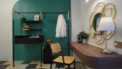 a bathroom with a sink and a mirror at Kimberley Boutique Hotel in George Town