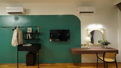 a bathroom with a sink and a mirror at Kimberley Boutique Hotel in George Town