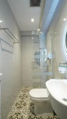 a bathroom with a toilet and a sink at Kimberley Boutique Hotel in George Town
