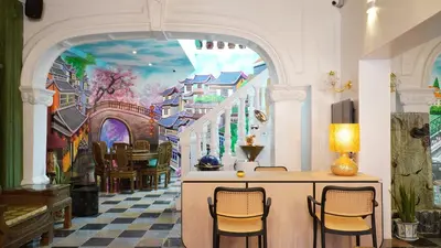a dining room with a mural of a street at Kimberley Boutique Hotel in George Town