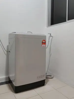 a white refrigerator sitting in a corner of a room at IPOH Waterpark Homestay By SummerStay 5km to IPOH TOWN in Ipoh