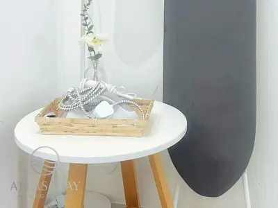 a basket on a table with a white table with a shelf at IPOH Waterpark Homestay By SummerStay 5km to IPOH TOWN in Ipoh