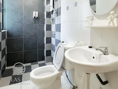 a bathroom with a toilet and a sink and a mirror at IPOH Waterpark Homestay By SummerStay 5km to IPOH TOWN in Ipoh