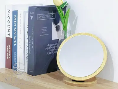 a mirror sitting on a table next to books at IPOH Waterpark Homestay By SummerStay 5km to IPOH TOWN in Ipoh