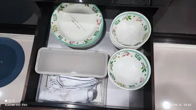 a box with three plates and a clock in it at kakao homestay ipoh town 2parking 3room 10pax wifi in Ipoh