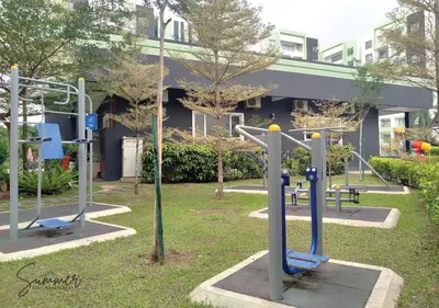 a park with several exercise equipment in front of a building at IPOH Waterpark Homestay By SummerStay in Ipoh