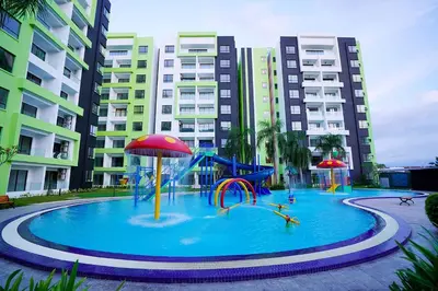 a large pool with a water park in front of some buildings at IPOH Waterpark Homestay By SummerStay in Ipoh
