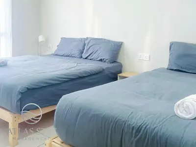 two beds sitting next to each other in a bedroom at IPOH Waterpark Homestay By SummerStay in Ipoh