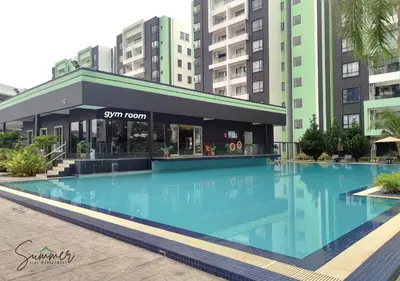 a large swimming pool in front of a building at IPOH Waterpark Homestay By SummerStay in Ipoh