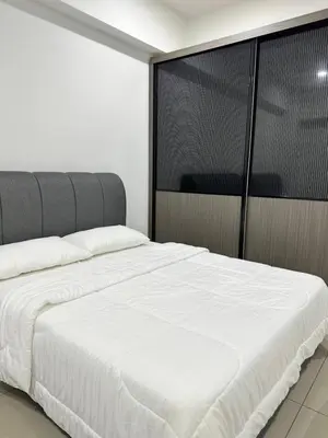 a bedroom with a large white bed in it at Manjung Vermogen Stay-Wi-Fi+KTV(Near Aeon) in Sitiawan