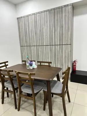 a wooden dining room table with chairs and a curtain at Manjung Vermogen Stay-Wi-Fi+KTV(Near Aeon) in Sitiawan